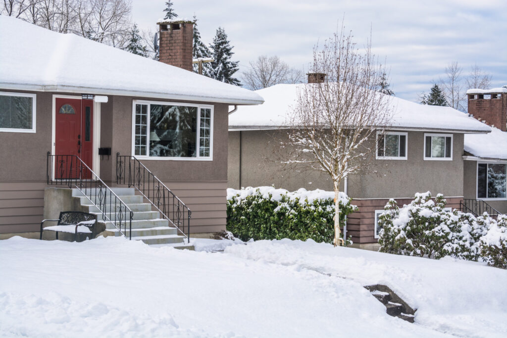 Grooved concrete steps showing surface wear from freeze-thaw cycles in winter.